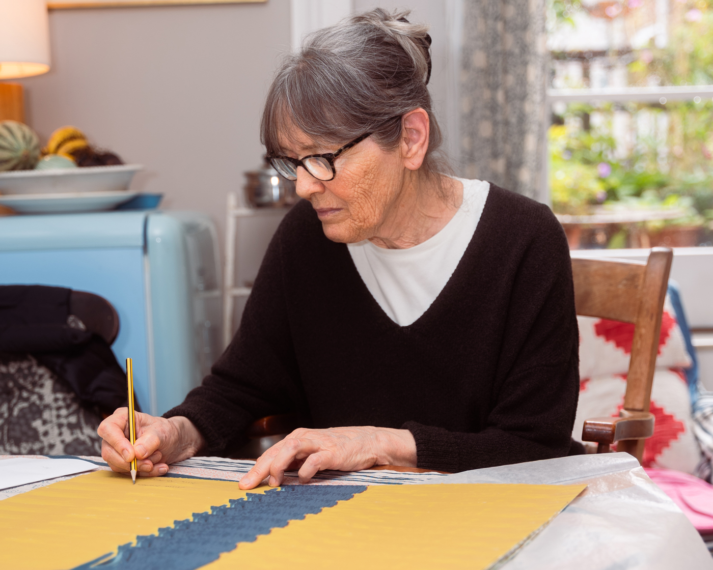Anne Rothenstein signing her edition at her home in London