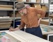 Billy Childish signing his edition in Counter Studio, Margate