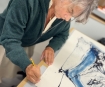 Tracey Emin signing her edition at Counter Studio in Margate