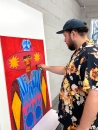 Studio Lenca hand-applying oil stick to each 'Libertad' print