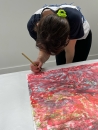 Francesca Mollett signing her prints