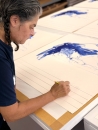 Tracey Emin signing her prints