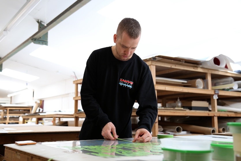 Eddie begins producing the edition by marking out a poem in tape