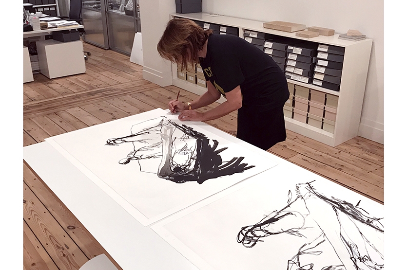 The artist signs and titles each work at Tracey Emin Studio, East London.