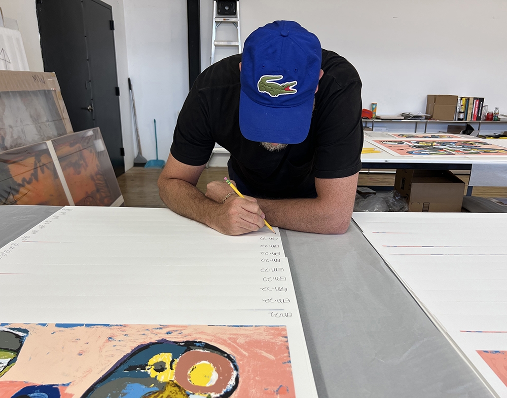 Eddie Martinez signing his prints for GREENPEACE 50 YEARS © Justin Robinson