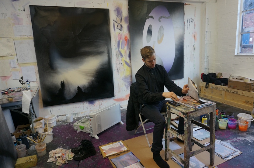 Eddie in his studio selecting the prints that will make the final cut of 100