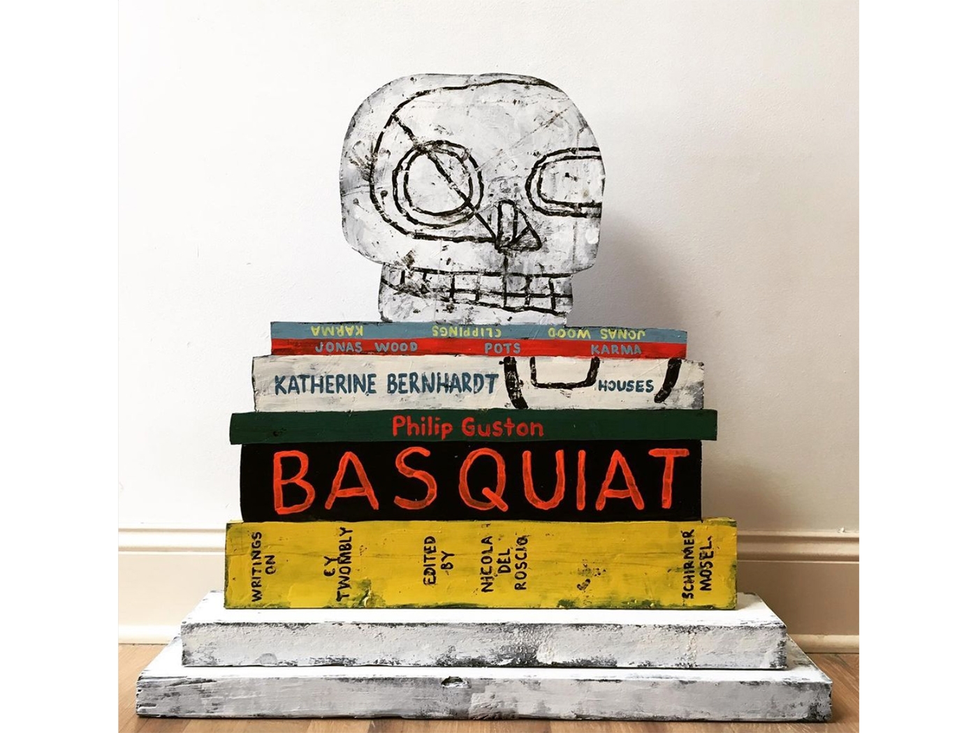 Jonathan Edelhuber’s work seeks to align his style alongside the canonical art figures of the contemporary art world. The recurring image of stacked books are often used by Edelhuber to create plinths for his own works. As seen here in 'Still Life With Skull and Art Books', (2019) referencing Katherine Bernhardt. 
