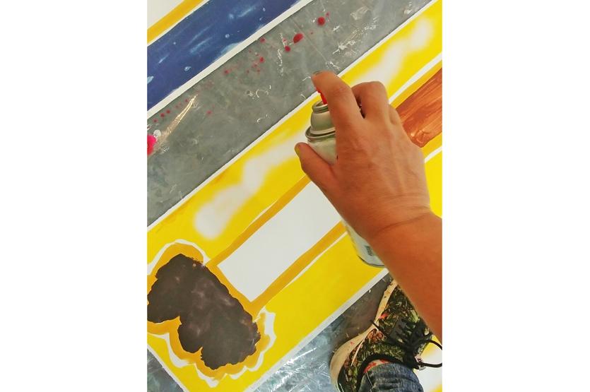 The artist spray paints the smoke onto each unique print