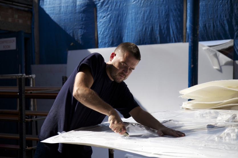 Cutting perspex sheets down, for transportation to studio