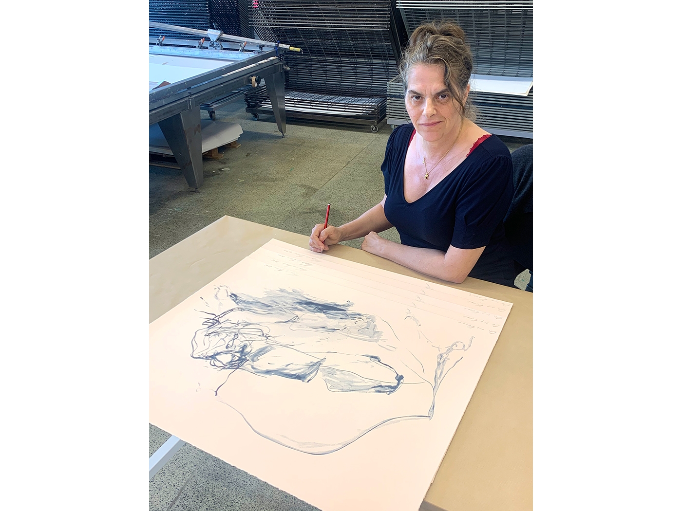 Tracey Emin signs 'On My Knees' (2021) in Counter Studio, Margate, 2021.