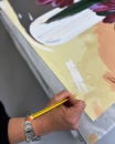 Clare Woods signing her edition in Counter Studio, Margate