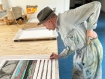 Billy Childish signing his print