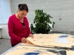 Tracey Emin signing her print, Just Waiting (2022), in Counter Studio, Margate.