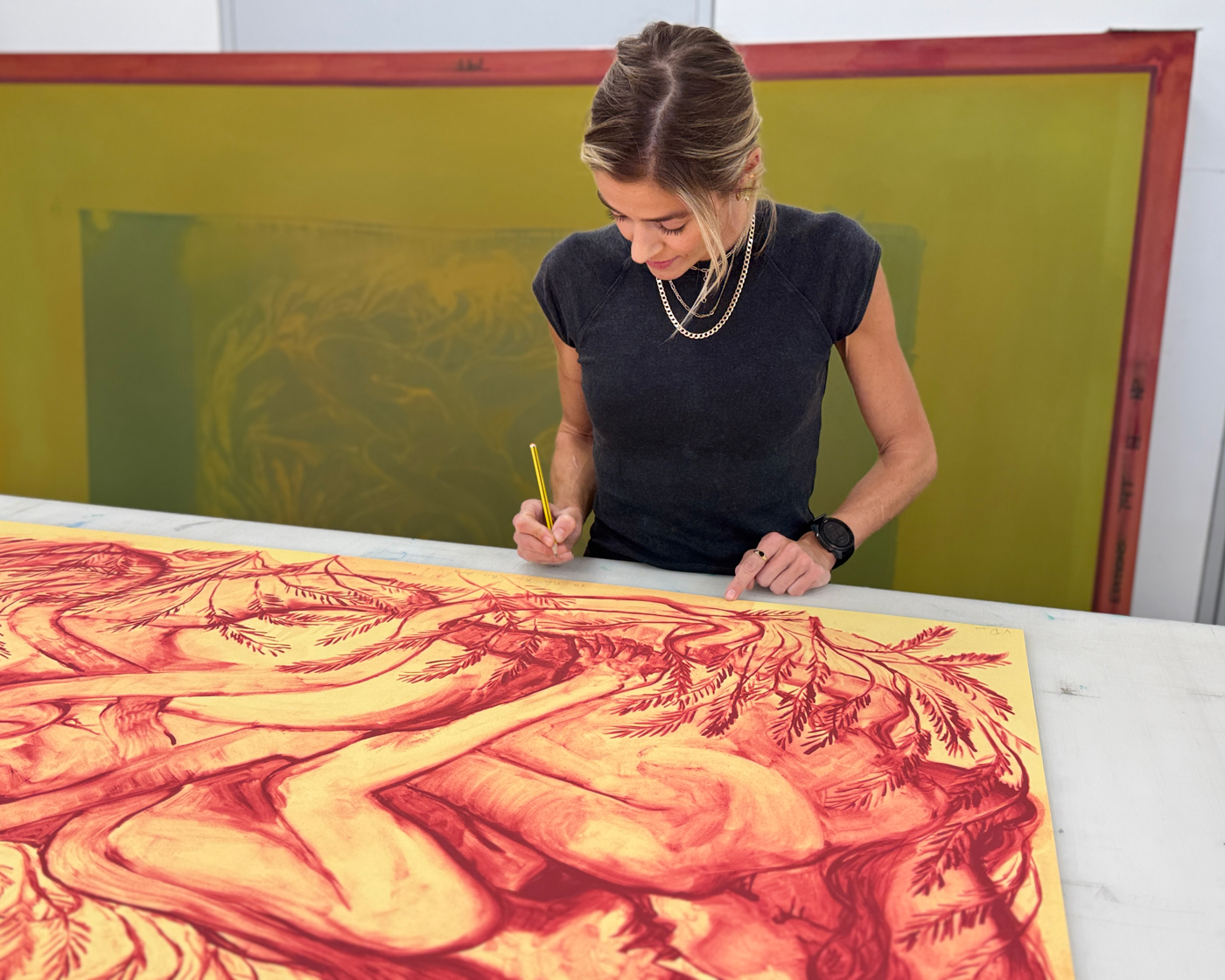 Vanessa Raw signing her limited edition print in Counter Studio, Margate