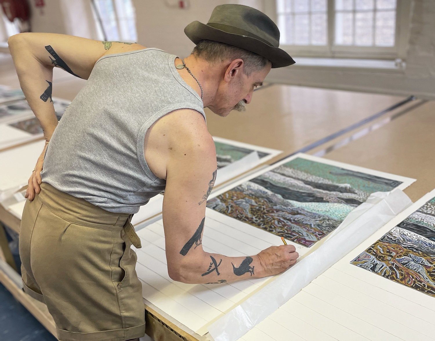 Billy Childish signing his prints for GREENPEACE 50 YEARS
