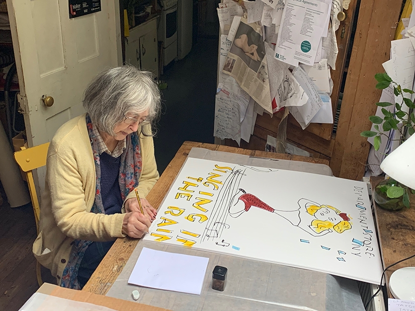 Rose signing her prints at her studio, Kent, 2019