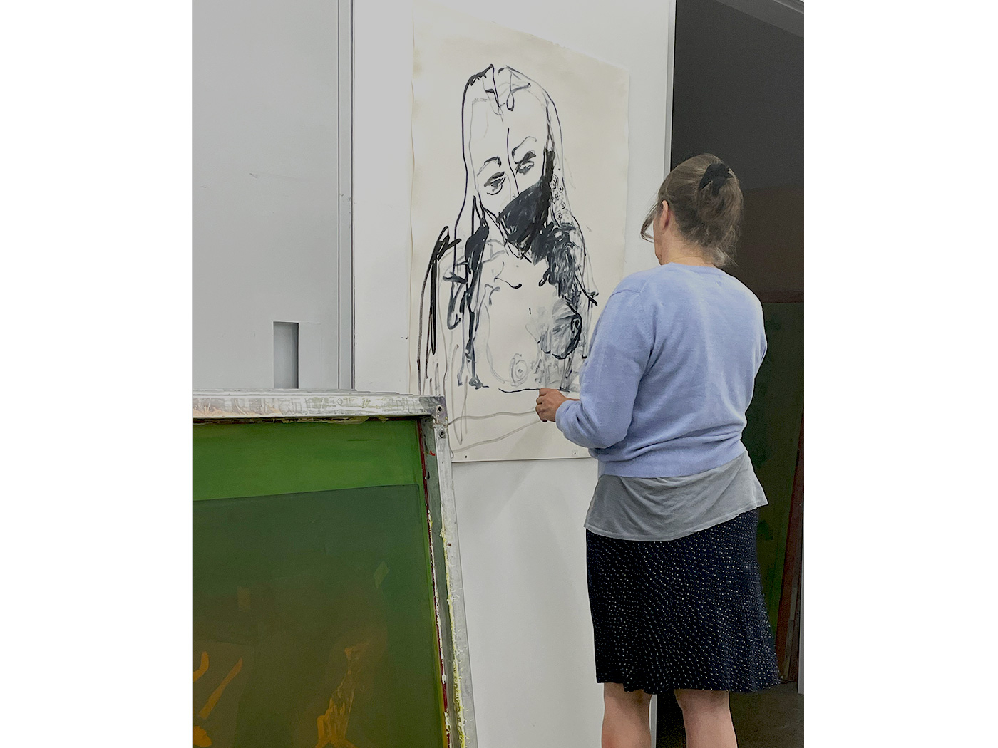 Tracey experimenting with hand-painting on a lithographs, from which a second plate will be made