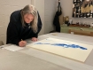 Lisa Brice signing their prints