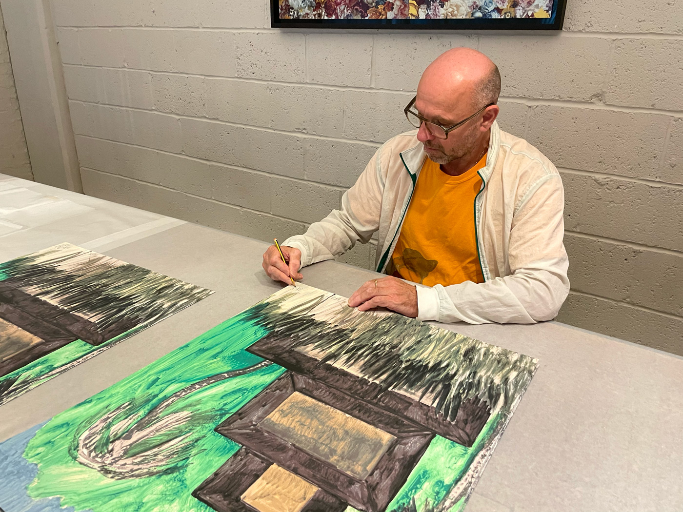 Peter Doig signing his print