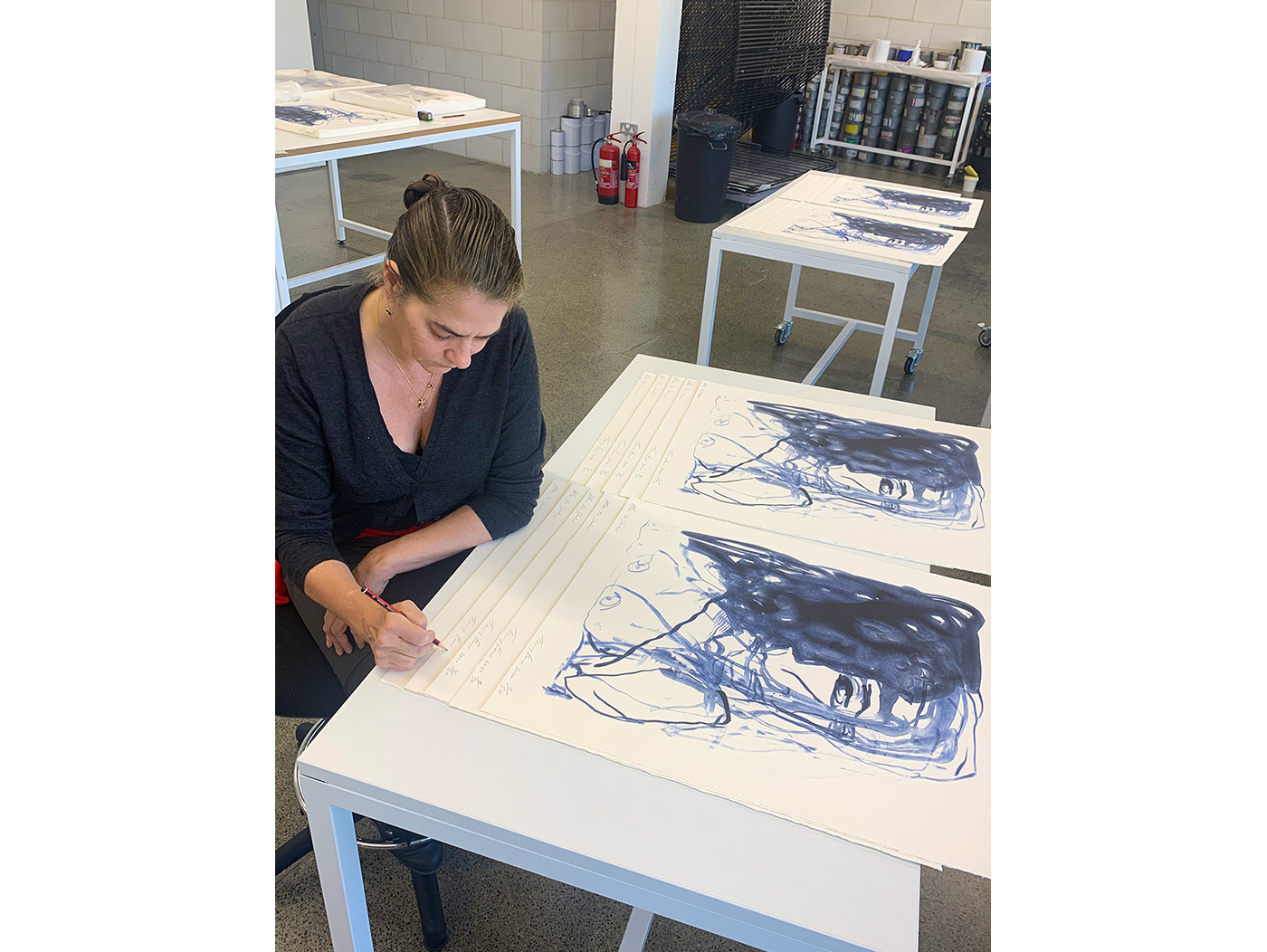 Tracey signs her new series of 8 lithographs in Counter Studio, Margate, 2020