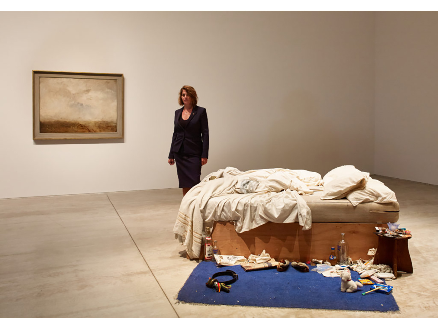In 1999 Tracey Emin was nominated for the Turner Prize for her notorious piece 'My Bed' (1998) - seen here installed at Turner Contemporary, Margate, 2017. This iconic work is referenced in her print 'On my Knees' (2021).
