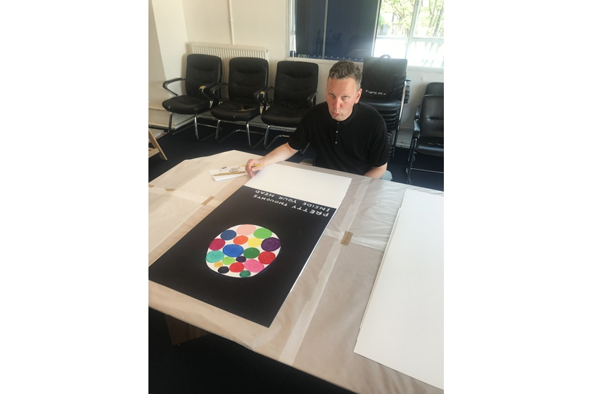 David signs the prints at Counter Editions offices, London.